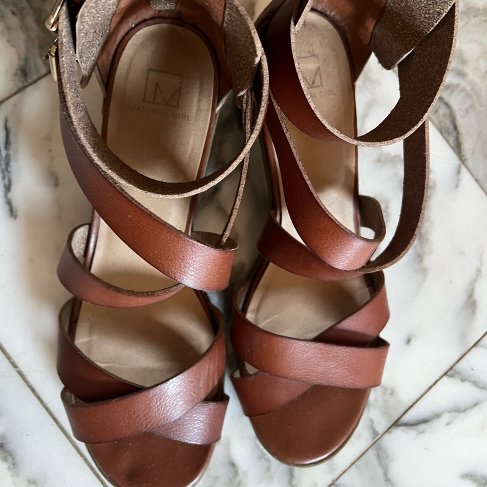 Brown leather crisscross, ankle strap and back zipper closure sandal. 1.5” heel.